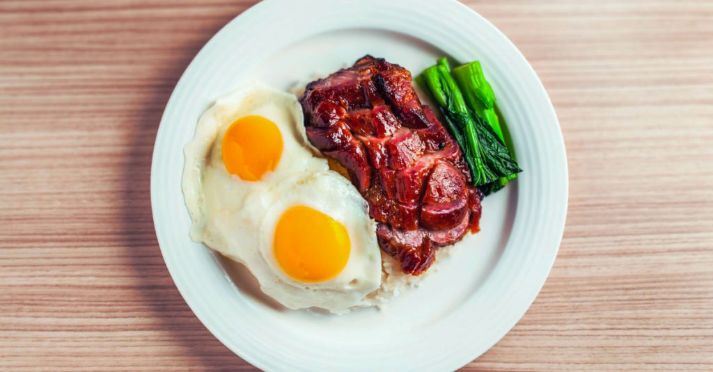 A bowl of poached eggs, lean beef, and vegetables representing Protein Mistakes After 30 and improved high-protein nutrition choices.