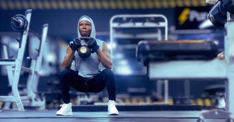 Anthony performing a goblet squat with a kettlebell demonstrating goblet squat muscles worked after 30 including quads, glutes, hamstrings, and core engagement.