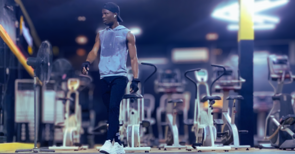 Anthony walking around the gym after a workout session, demonstrating Why Recovery Matters More After 30 and the benefits of active recovery for overall fitness.