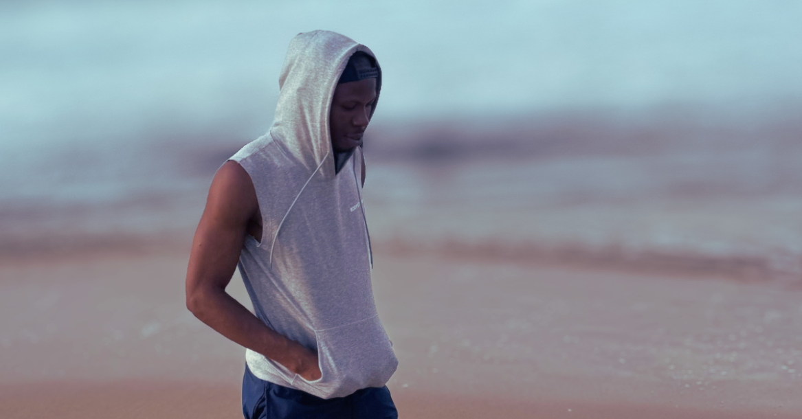 Anthony walking along the beach in the morning, demonstrating one of the Best Morning Habits for Weight Loss After 30 through regular physical activity and movement.