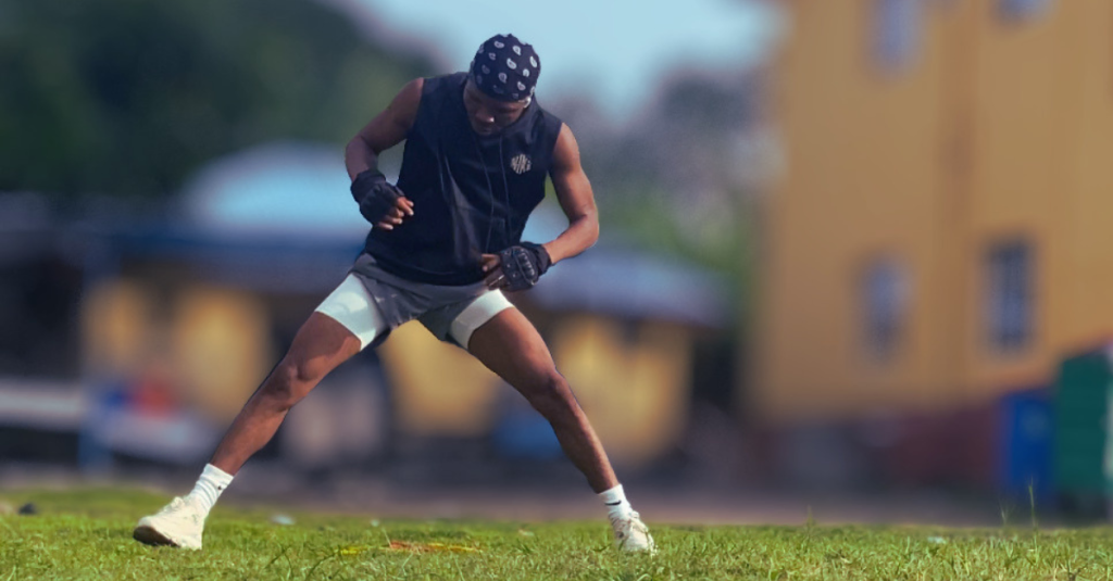 Anthony preparing to perform a side lunge exercise, demonstrating proper movement and avoiding common fitness mistakes after 30.