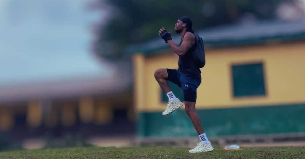 Anthony performing high knees during a workout as part of learning how to start a fitness journey after 30.