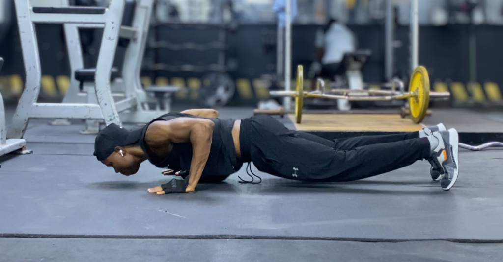 Anthony performing push-ups during a 30-minute full-body home workout after 30 to build upper-body strength and core stability.