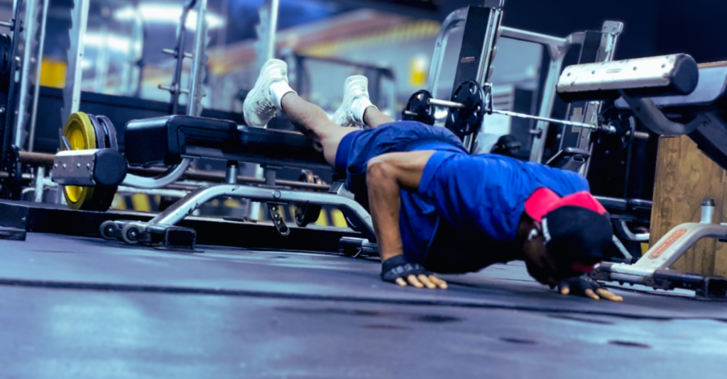 Anthony performing a decline push-up during a workout, demonstrating How Often Should You Strength Train After 30? through consistent upper-body strength training.