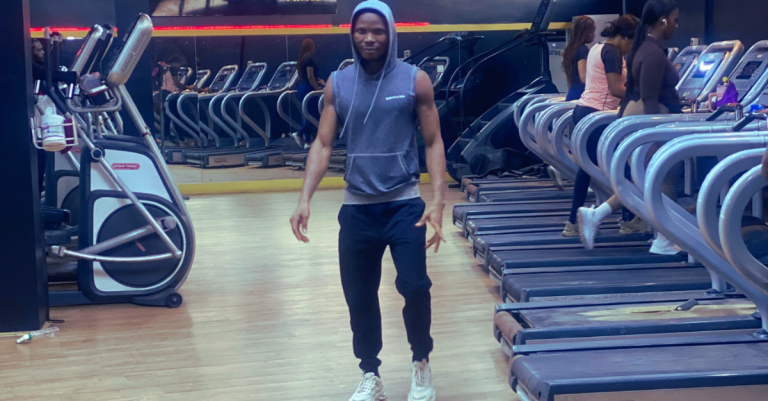 Anthony resting after a workout session, highlighting Why Recovery Matters More After 30 and the importance of allowing the body time to recover after exercise.