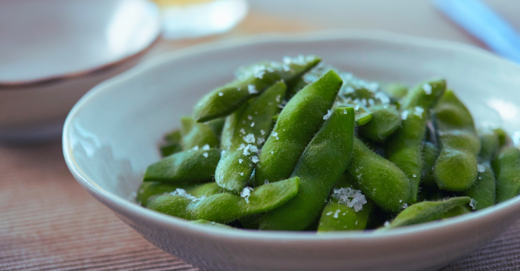 Bowl of edamame, a nutritious option among high-protein snacks for weight loss, providing plant-based protein, fiber, and essential nutrients.