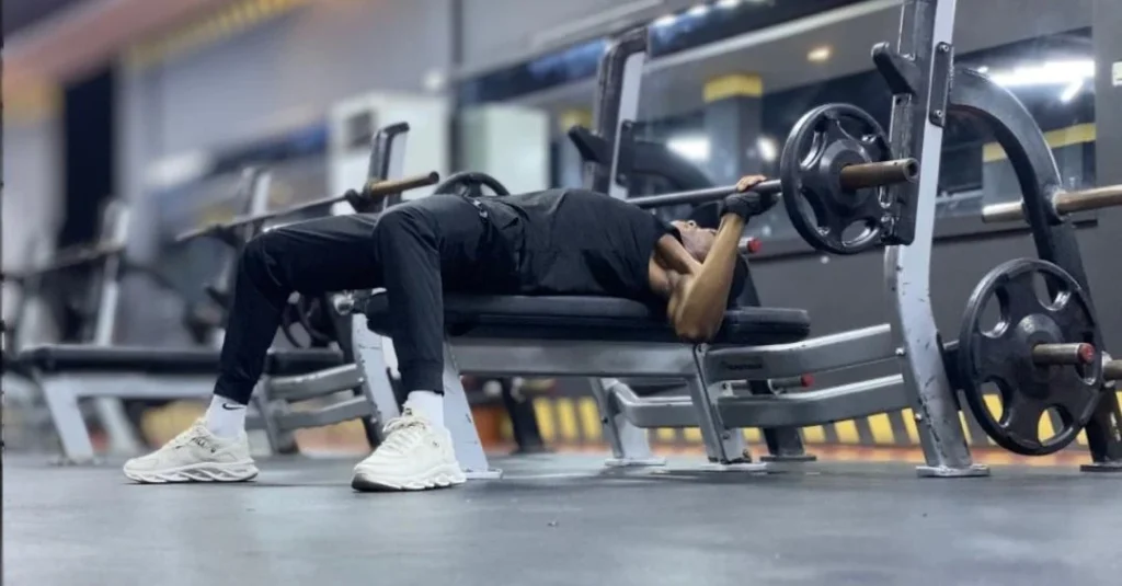 Strength Training: Anthony performing a bench press to build upper-body strength and muscle.