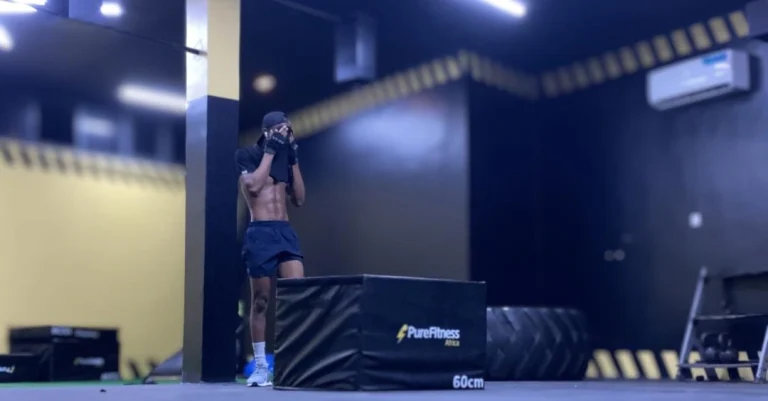 Anthony just finished a workout session as part of his journey on How to Lose Belly Fat After 30, standing confidently after exercising.