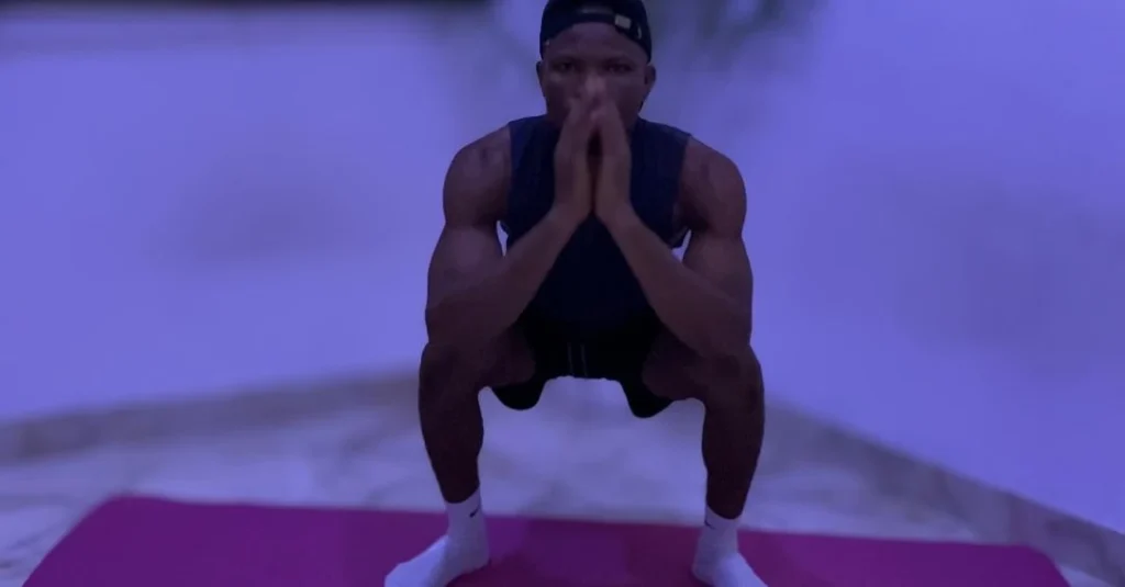 Home Workout Mistakes: Anthony performing a squat with proper form during a home fitness workout session.