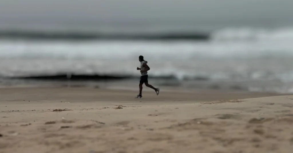 Weight Loss After 30: Anthony jogging along the beach as part of a cardio routine for fat loss and improved fitness.