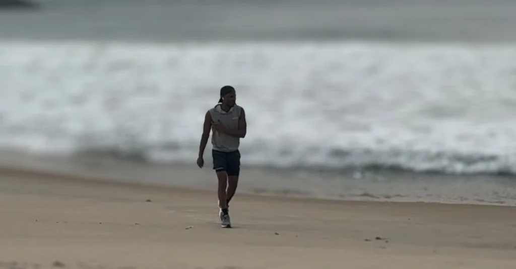 Weight Loss After 30: Anthony taking a walk along the beach as part of a low-impact fat loss and active lifestyle routine.