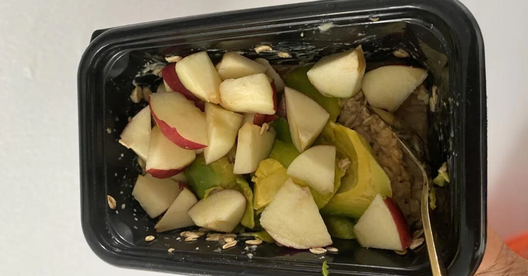 Bowl of overnight oats topped with nuts and fresh fruits, showcasing high-calorie foods that can support healthy weight gain and sustained energy.