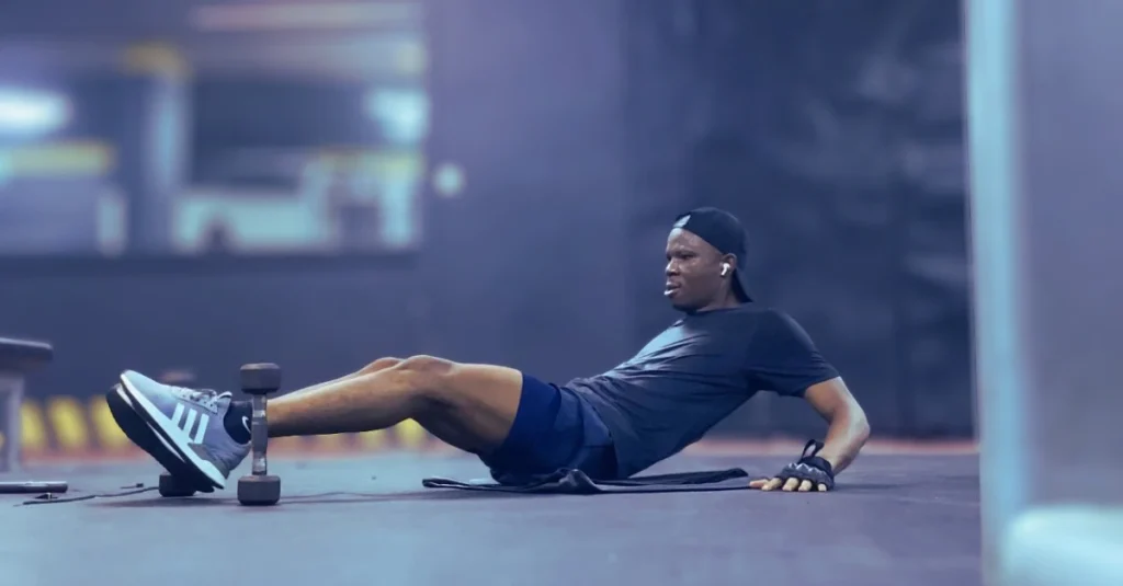 Anthony is performing abdominal exercises during a gym workout for How to Lose Belly Fat After 30 by strengthening his core.