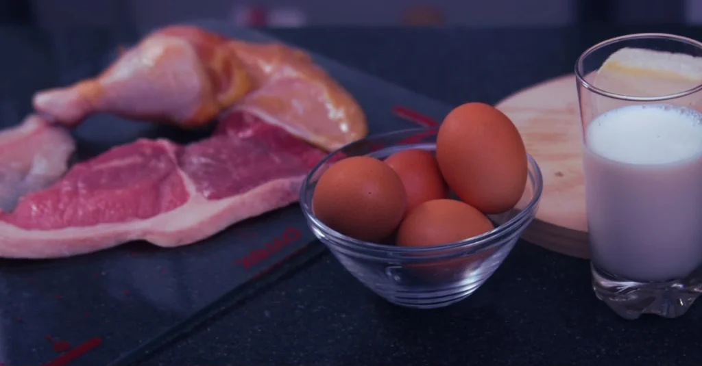 Best protein foods after 30 including raw lean beef, chicken thighs, raw eggs, and a glass of milk