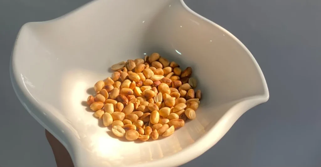 Anthony holding a bowl of groundnuts while discussing my protein mistakes after 30