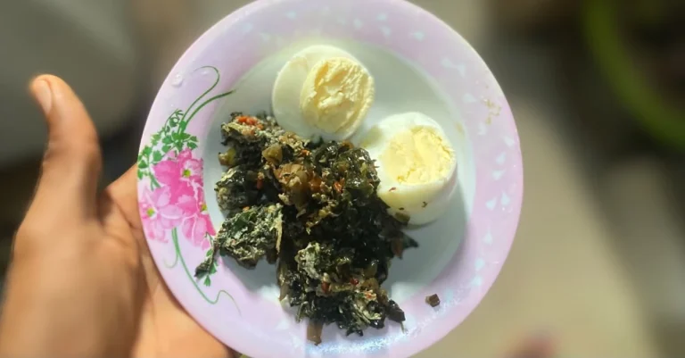 Anthony holding a bowl of boiled eggs and vegetables, showing high-protein foods