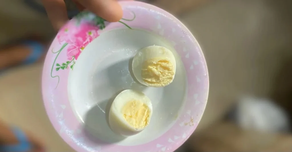 Anthony holding a bowl of diced boiled eggs, highlighting high-protein foods