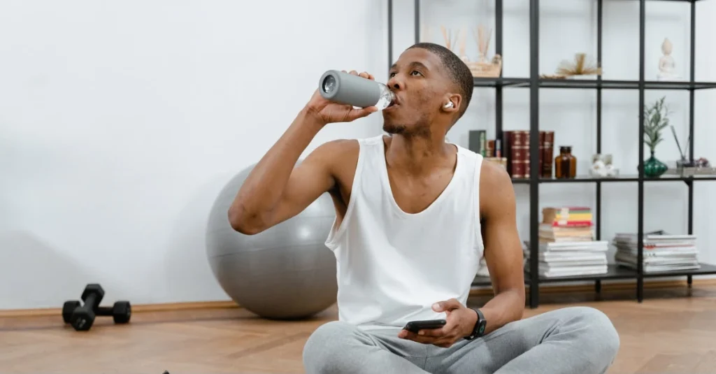 Man drinking water for recovery tips