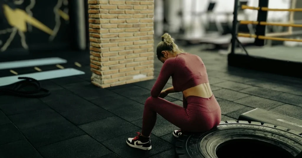 Woman resting between exercise sets