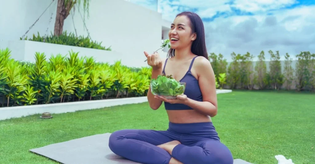 Side view of a woman eating a healthy meal to support healthy eating habits after 30.