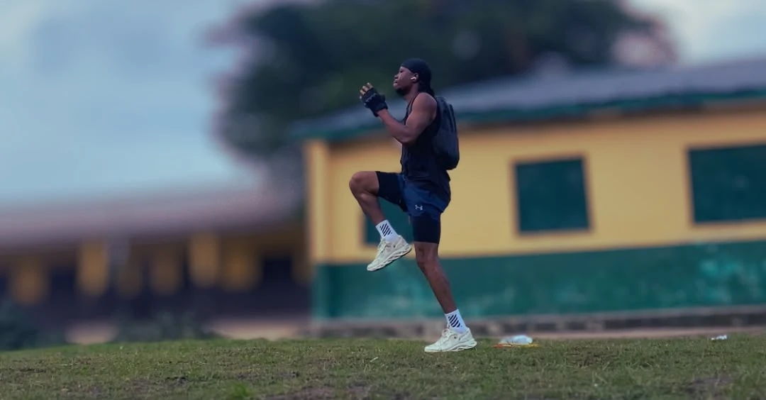 High Knees Exercise demonstration by Anthony showing proper running form with knees lifted high to improve cardio fitness and endurance.