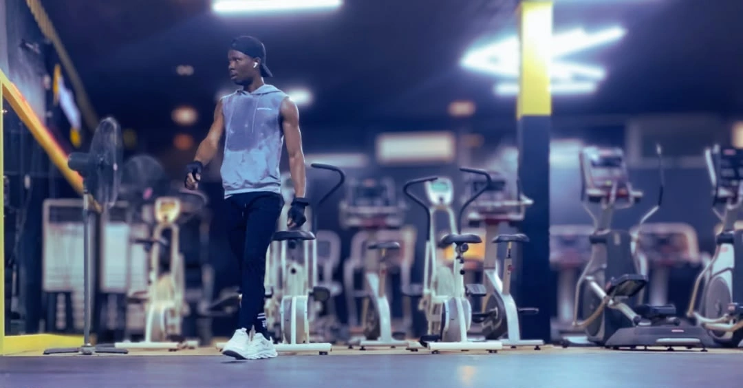 Anthony is resting after finishing a workout session to stay motivated during weight loss after 30