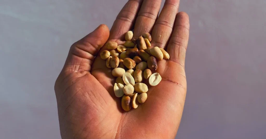 Anthony holding groundnuts in his palm as one of the best high-protein foods for healthy snacking after 30