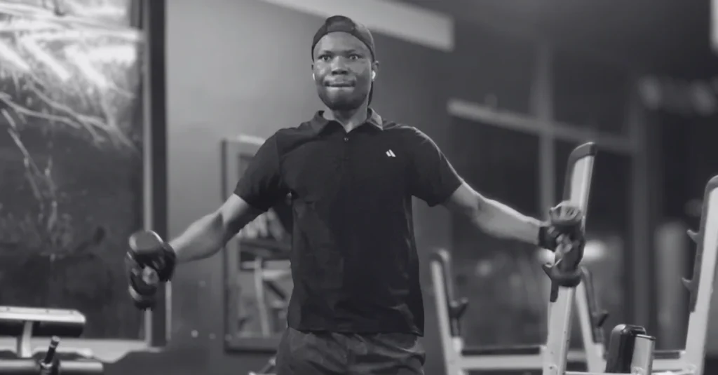 Anthony is performing dumbbell lateral raises to build stronger shoulders with proper lifting technique