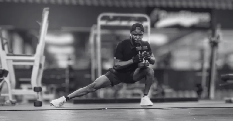 Side lunges with a dumbbell performed by Anthony during a lower-body strength workout