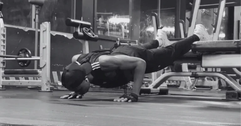 Anthony performing a decline push-up as part of a strength workout for how to lose upper body fat after 30.