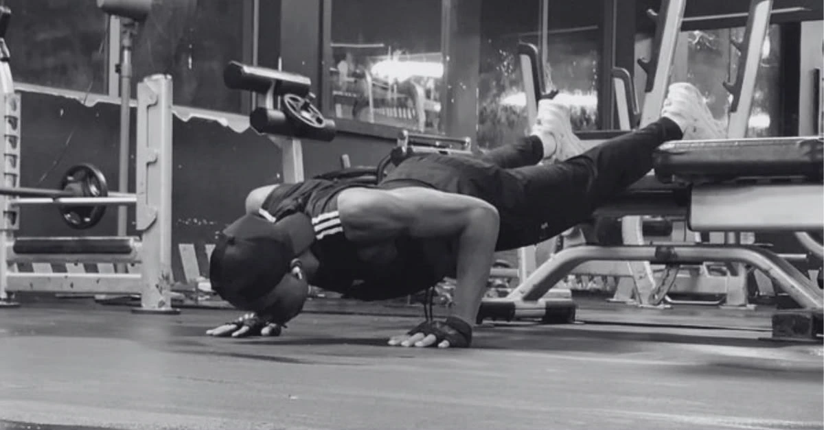 Anthony performing a decline push-up as part of a strength workout for how to lose upper body fat after 30.
