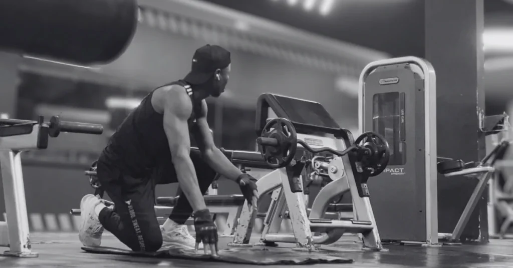 Anthony taking a short rest between exercises during a workout for how to lose upper body fat.