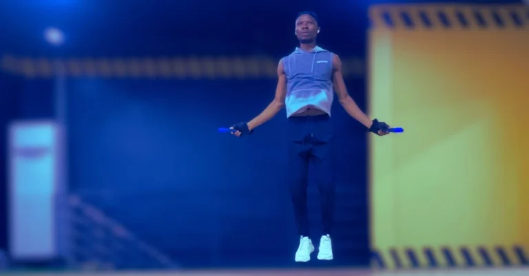 Anthony performing a jump rope exercise with proper form during a cardio workout.
