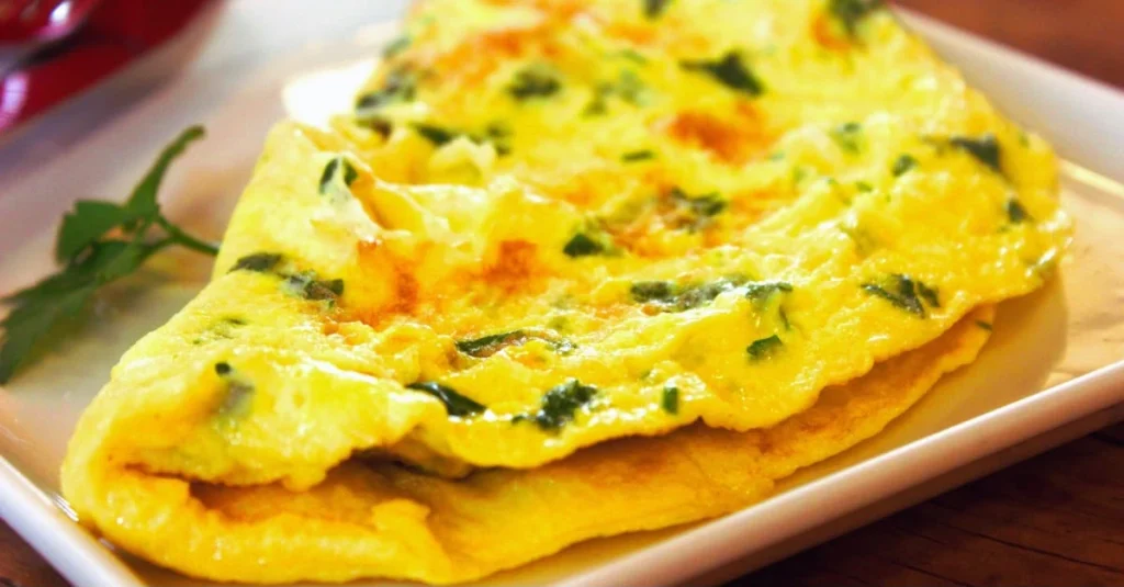 High-Protein Low-Carb Meals featuring a bowl of egg and vegetable omelet made with protein-rich eggs and fresh vegetables