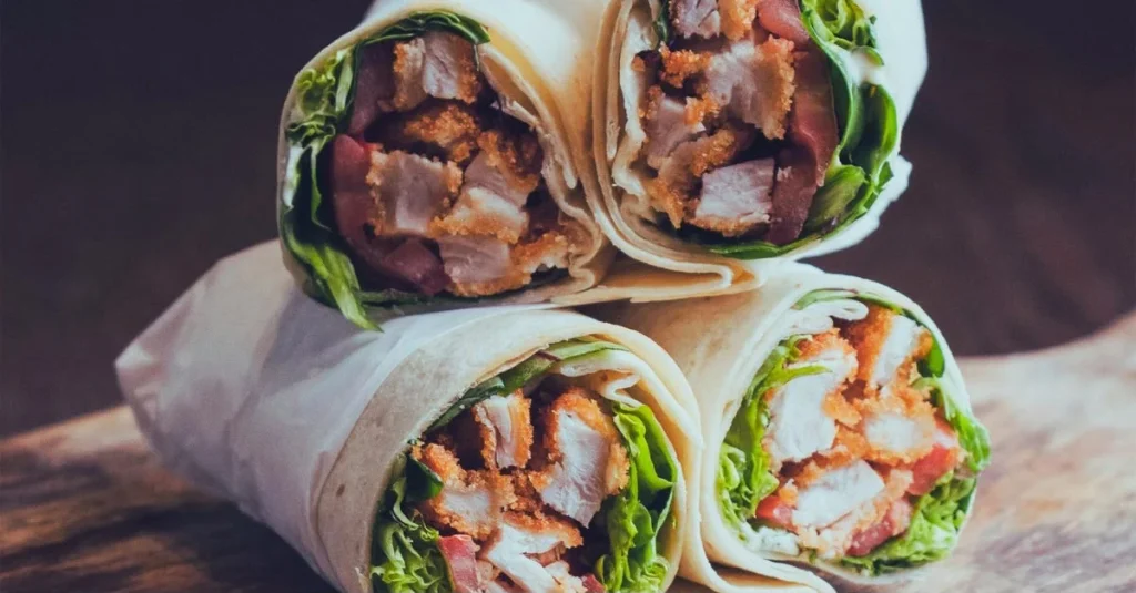 High-Protein Low-Carb Meals featuring a turkey lettuce wrap filled with lean turkey, fresh vegetables, and low-carb ingredients