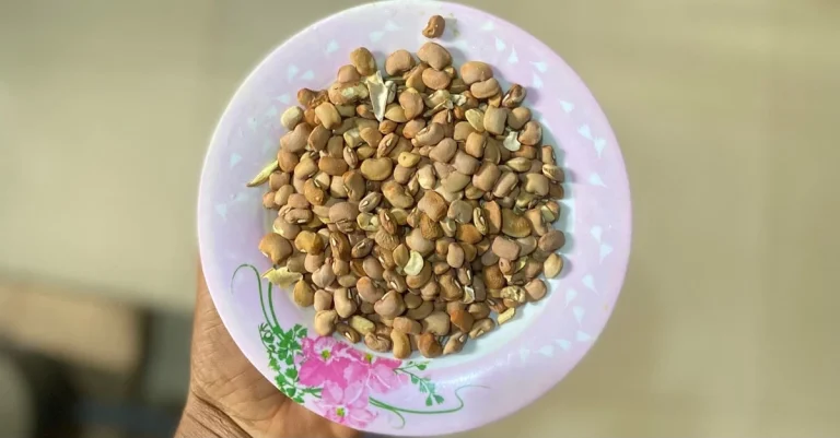 Anthony holding a bowl of beans, illustrating high-protein foods for muscle building.