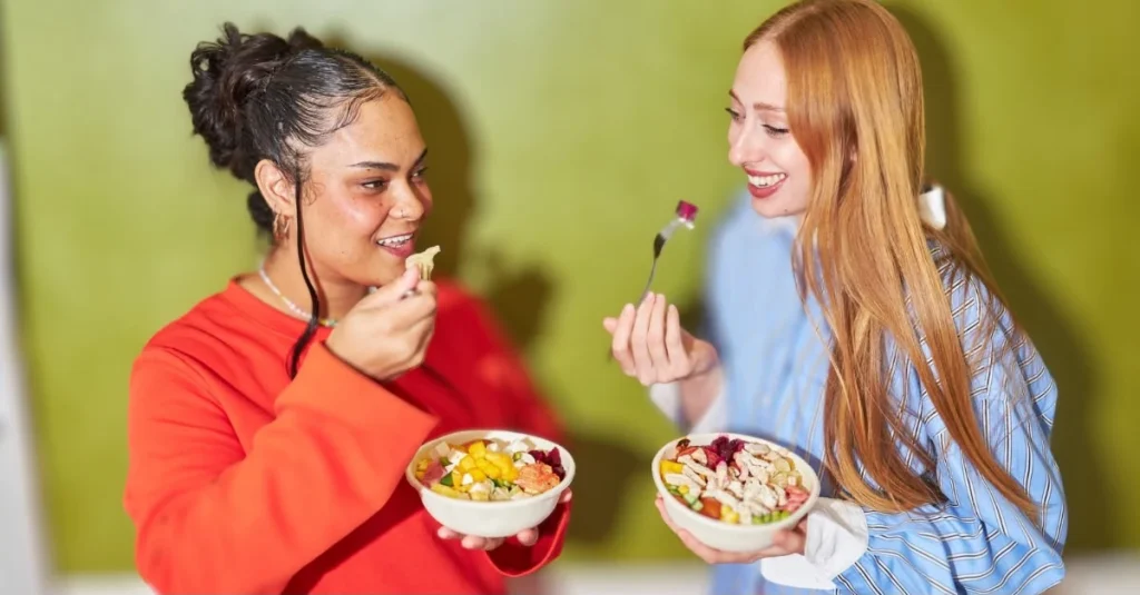 Two ladies practicing healthy eating habits while enjoying a meal