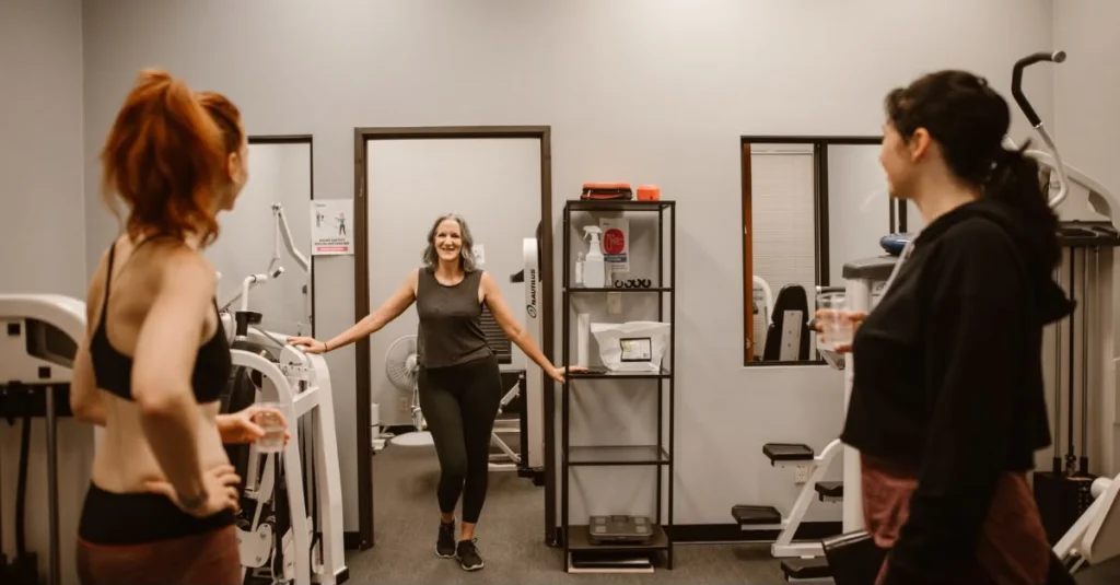 Three women chatting during a workout session