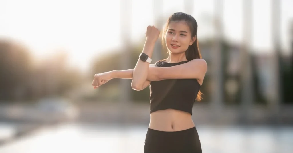 Woman doing arm circles as part of her fitness routine after 30
