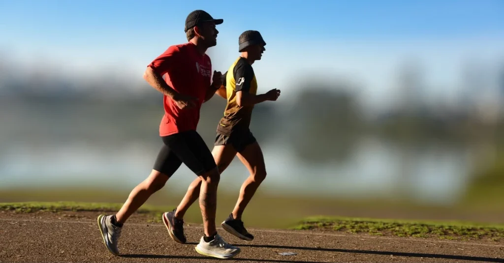 Two athletes jogging outdoors for fitness after 30