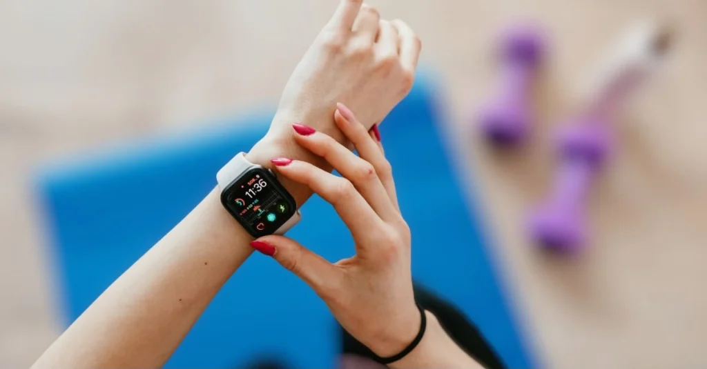 Lady setting up her smartwatch before a workout to track fitness progress