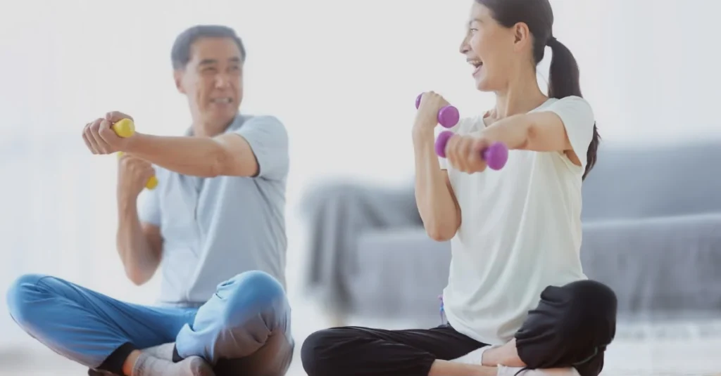 Couple exercising with dumbbells in their living room to avoid home workout mistakes