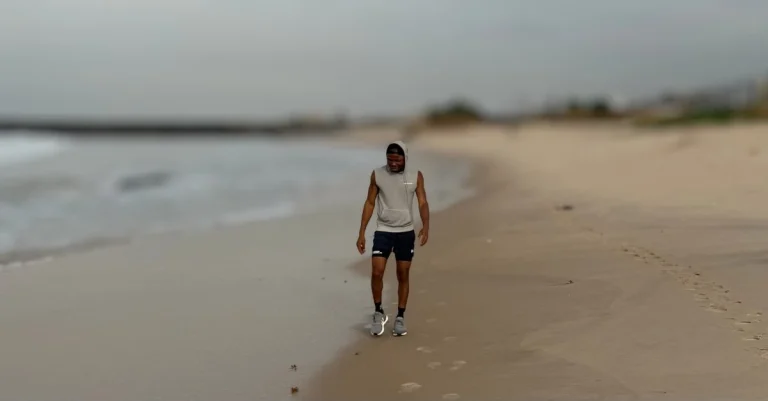 Can You Lose Weight by Walking? Anthony walking along the beach to support a healthy weight-loss journey after 30.