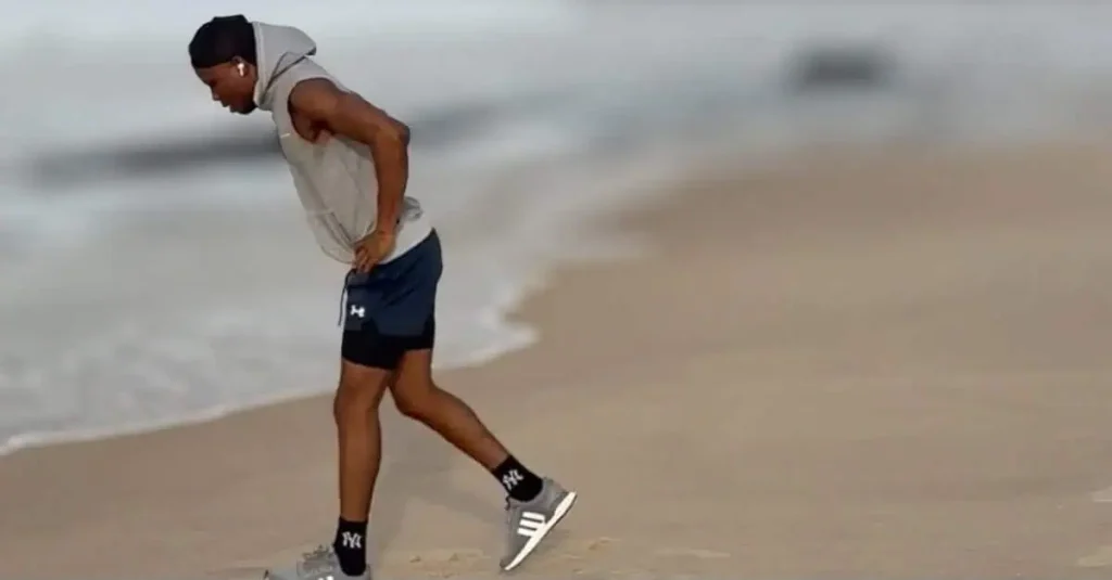 Anthony demonstrating how to do jump lunges while switching legs in midair