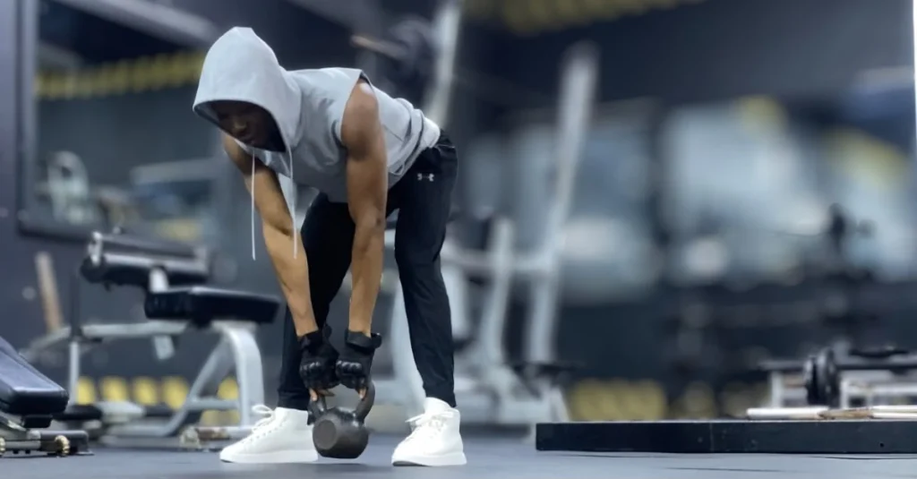 Anthony doing a kettlebell workout for strength training recovery tips